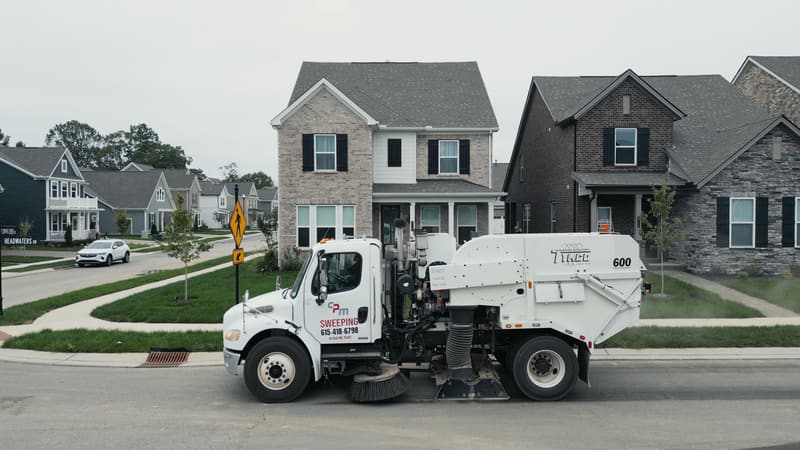 CPM sweeper truck working a neighborhood street